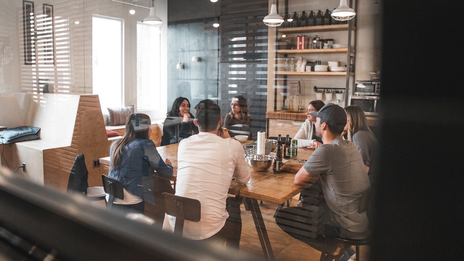 A team collaborating around a table in a bright workspace